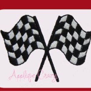 May include: Embroidered patch featuring two crossed checkered racing flags in black and white. The flags are waving, with detailed stitching. The patch has a white border and the text "Applique Crazy" in cursive.