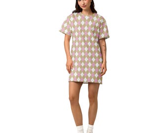 May include: A short-sleeve t-shirt dress featuring a repeating argyle pattern in shades of tan, white, and light pink. The garment has a crew neckline and a straight hemline that falls above the knee, constructed from a lightweight fabric.