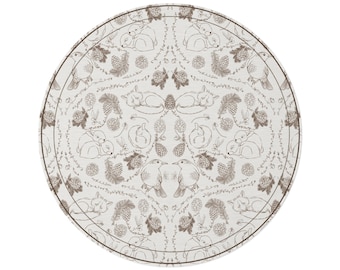 May include: A circular mat featuring a repeating brown line-art pattern on a white background. The design includes illustrations of sleeping foxes, rabbits, and birds interspersed with pinecones, acorns, and delicate leafy branches.