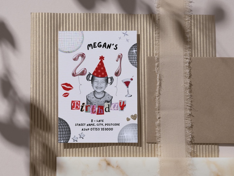 21st Birthday Invitation Template featuring a picture of a toddler wearing a party hat, balloons with a 2 and a 1, disco balls, scrapbook lettering, a cocktail, disco balls, lipstick kisses, sparkles, leopard print hearts and black text with the event details. The invite is on a placemat next to a brown envelope, with the shadow of a tree across the image.