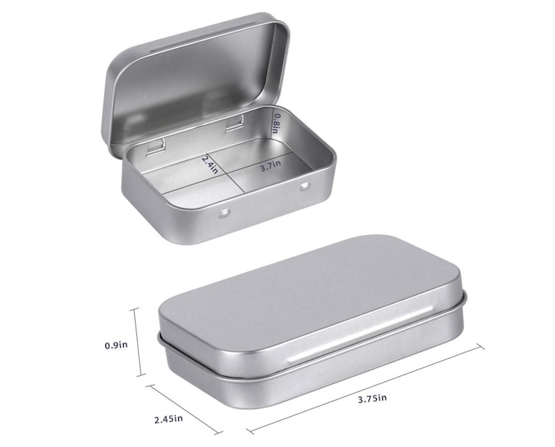 May include: Two small, rectangular, silver-colored metal tins. One tin is open, revealing the interior, and the other is closed. The open tin measures 3.7 inches long, 2.4 inches wide, and 0.8 inches deep. The closed tin is 3.75 inches long, 2.45 inches wide, and 0.9 inches high.