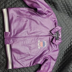 May include: A rustic wooden sign with the text "Welcome to our home" in white lettering. The sign features a distressed finish and a simple, inviting design, perfect for a front porch or entryway.