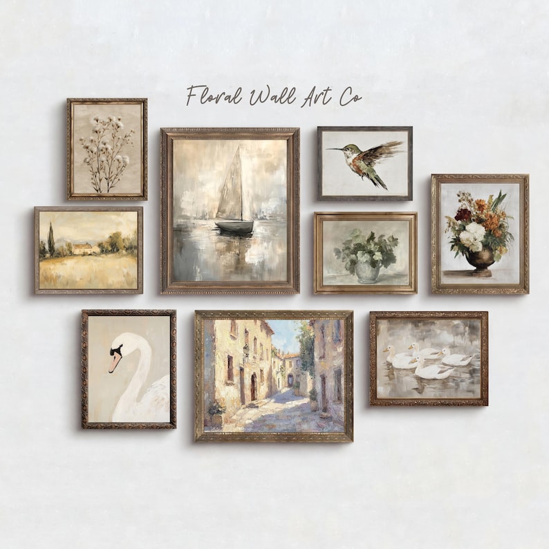 A French country art arrangement with eight vintage-inspired printable pieces. The set includes a cotton stem botanical, a misty field landscape, a sailboat on calm water, a hummingbird study, a pale floral vase, a white swan portrait, a sunlit European street scene, and swans gliding across water. Colors stay light and muted, with beige, cream, gray, pale green, and soft blue tones that give the bundle a calm, collected gallery wall feel.