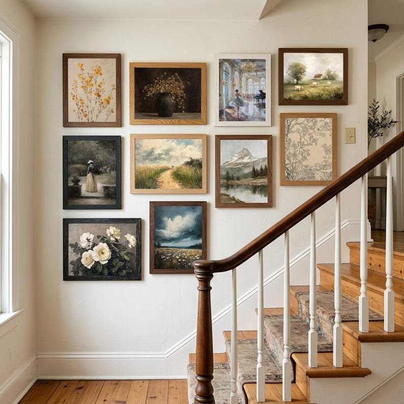 A coordinated gallery wall set of French country printable art featuring botanical stems with yellow flowers, a dark floral still life in a vase, a ballerina in a grand blue interior, cows in a green meadow, a woman standing in a garden, a sunlit path through grasses, a mountain lake landscape, a toile-style botanical drawing, white roses, and a stormy field scene. The artwork feels soft, vintage, neutral, and countryside inspired.