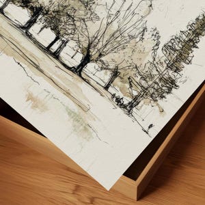 A close detail of a minimal landscape drawing on textured paper, showing slender trees lined across a gentle hillside. The artwork uses loose black ink lines with pale watercolor washes in beige, gray, and soft green. The composition feels airy, understated, and organic, with open negative space and sketch-like movement. It fits the quieter side of the French country printable bundle, where botanical and landscape studies create a collected vintage look.