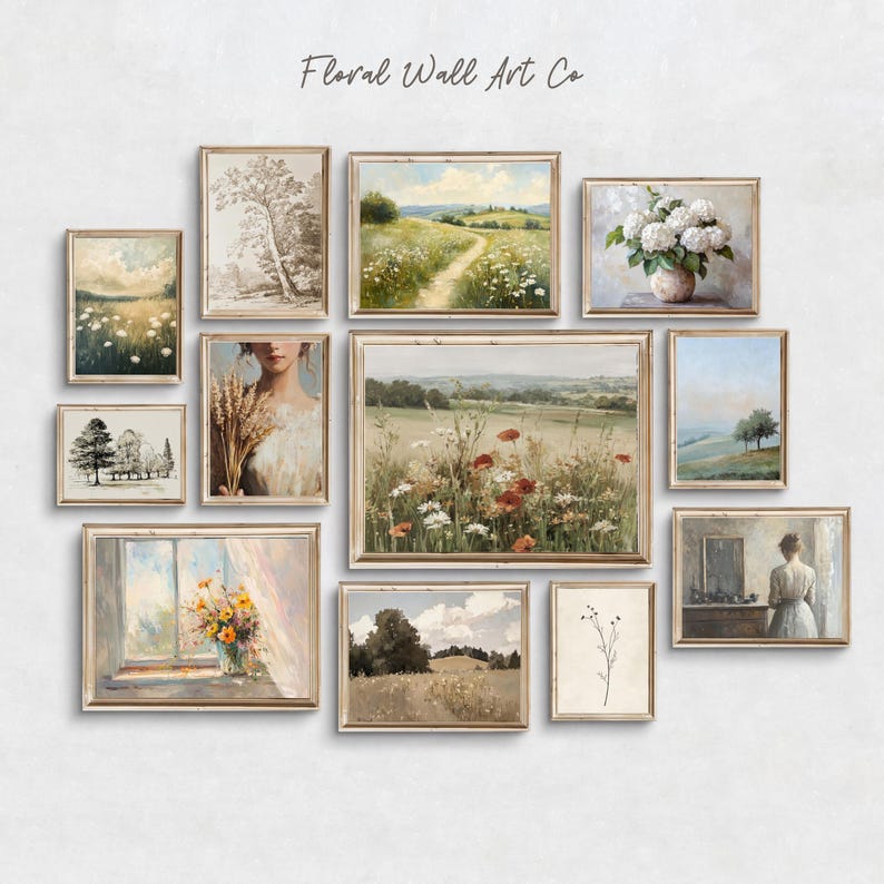 A neutral vintage printable art collection arranged as a French country gallery wall. Visible pieces include soft meadow landscapes, a sepia tree sketch, a winding path through wildflowers, a white hydrangea vase, a minimal tree landscape, a partial portrait of a woman holding wheat, a wide wildflower field, a sunlit floral painting by a window, a rolling field under clouds, a delicate botanical stem, and a quiet interior figure scene.