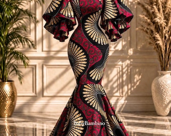 May include: A vibrant, floor-length dress with a striking pattern of red, black, and gold fan-like designs. The dress features a square neckline, dramatic ruffled sleeves, and a mermaid silhouette. The dress is displayed on a mannequin.