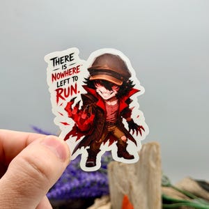 May include: A die-cut sticker featuring a stylized character wearing a brown cap and coat with red accents. The character has glowing red eyes, sharp claws, and a sinister grin. The text "THERE IS NOWHERE LEFT TO RUN" is printed in black and red.