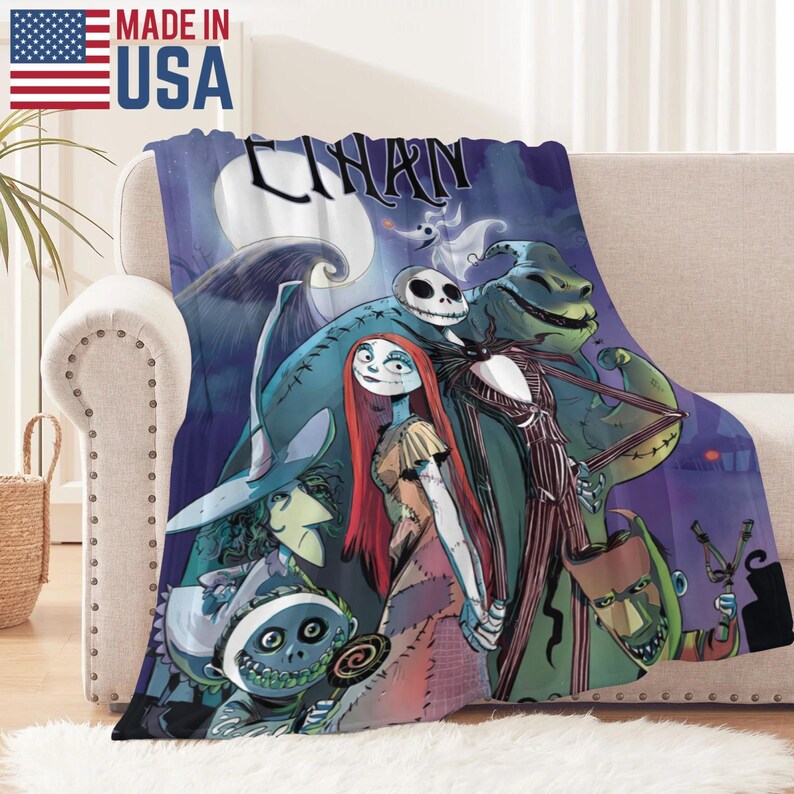 May include: A plush throw blanket featuring characters from "The Nightmare Before Christmas" against a dark blue night sky with a full moon. The blanket displays Jack Skellington, Sally, and other characters. The words "CHARN" are visible on the blanket. Made in the USA.