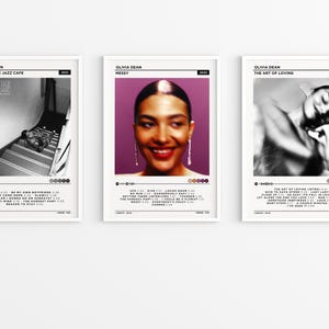 May include: Three framed art prints with album art. The first shows a black and white photo of a person on stairs. The second is a portrait of a woman with a purple background. The third is a black and white photo of a person. Each print has text.