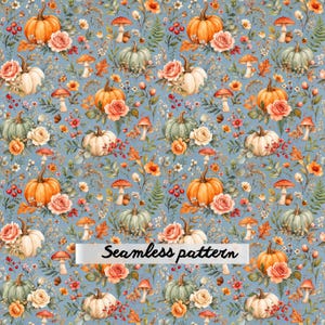 May include: A seamless pattern on a light blue background featuring orange and green pumpkins, pink roses, red berries, brown mushrooms, and autumn leaves. The text "Seamless pattern" is printed in black across the center of the image.