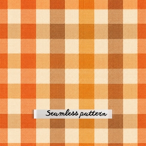 May include: A seamless pattern featuring a repeating gingham check design in shades of orange, brown, and cream. The fabric-like texture displays a grid of intersecting vertical and horizontal stripes. A white rectangular label displays the text Seamless pattern.