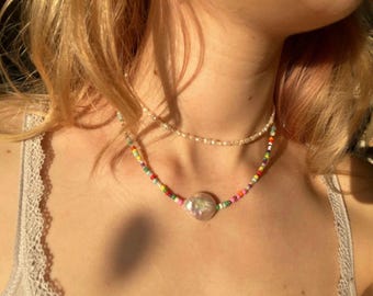 Colorful, handmade pearl necklace with a freshwater pearl as a statement piece.