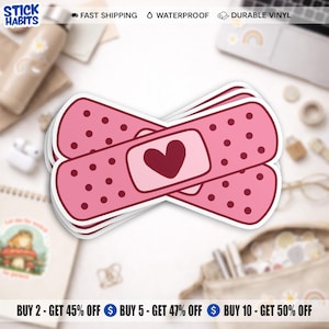 May include: Pink bandage stickers with a heart design. The stickers have a dotted pattern and a heart in the centre. The stickers are waterproof and made of durable vinyl. The text "STICK HABITS" is in the upper left corner.