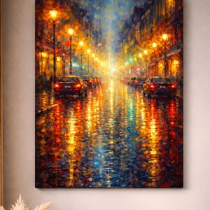 May include: An impressionistic painting of a city street at night. The artwork depicts a wet street reflecting the warm glow of streetlights and car headlights. Cars are parked along the sides of the street. The color palette is dominated by oranges, yellows, and blues.