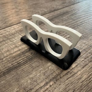Glasses Business Card Holder on a wood background.