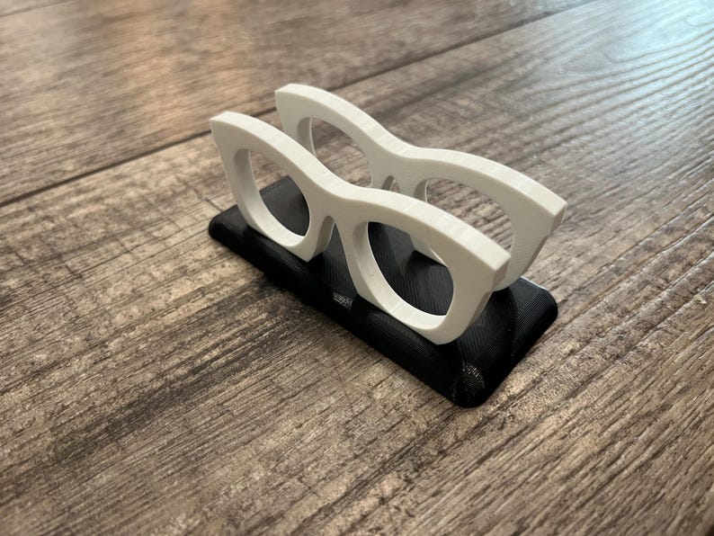 Glasses Business Card Holder on a wood background.