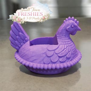 May include: A set of three ceramic mugs with a speckled, matte finish. The mugs are in shades of cream, light gray, and dark gray. Each mug has a simple, minimalist design and a rounded handle.