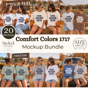 May include: A collection of twenty Comfort Colors 1717 t-shirt mockups featuring various colors including white, cream, brown, sage green, and blue. Each shirt displays the text YOUR DESIGN HERE in a dark blue serif font on the chest area.