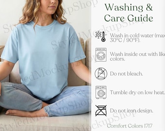 May include: A light blue t-shirt with a crew neck and short sleeves. The image includes a washing and care guide with instructions to wash in cold water (max 90°F), wash inside out, do not bleach, tumble dry on low heat, and do not iron the design.
