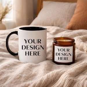 May include: A white ceramic mug with a black handle and the text "But First, Coffee" in a bold, black font. The mug is set against a blurred background, suggesting a cozy setting.