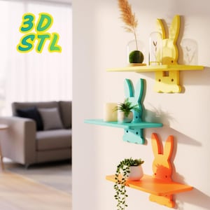 Könnte beinhalten: Drei farbenfrohe, hasenförmige Wandregale. Die Regale sind gelb, türkis und orange und tragen dekorative Elemente wie Pflanzen und Kerzen. Der Text "3D STL" ist im Bild zu sehen.