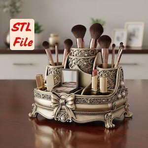 May include: An ornate, antique-style makeup organizer in a bronze finish. It features multiple compartments for brushes, lipsticks, and a compact mirror. The design includes a large bow and decorative detailing. The text "STL File" is in the upper left corner.