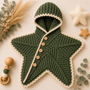 May include: A dark green star-shaped hooded crochet blanket featuring a cream-colored scalloped border and five wooden buttons along the diagonal front opening. The textured knit fabric forms a distinct star silhouette with a pointed hood at the top.