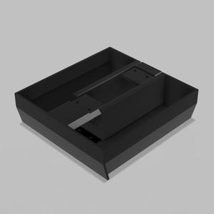 May include: A matte black rectangular drawer organizer tray featuring multiple internal compartments of varying sizes. The tray has a solid base and angled side walls, with a central divider section that includes small circular holes for structural support.