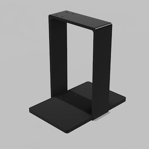 May include: A matte black metal stand featuring a rectangular base and a vertical U-shaped frame. The top horizontal section of the frame includes four small circular pre-drilled holes, and the base plate also features four small circular pre-drilled holes.