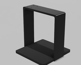 May include: A matte black metal stand featuring a flat square base and a vertical U-shaped frame. The top horizontal section of the frame includes four small pre-drilled holes, while the base plate also contains four small pre-drilled holes.