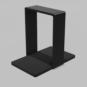 Pode incluir: Um suporte preto, de estilo moderno, com uma base retangular e um topo em forma de U. O suporte é feito de um material sólido e tem um design minimalista. O topo tem quatro furos.