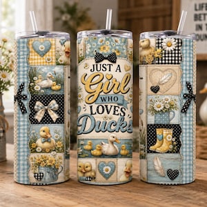 May include: Three insulated tumblers with lids and straws. The tumblers feature a patchwork design with duck and floral motifs, hearts, and the text "Just a Girl Who Loves Ducks." Each tumbler has a black bow.