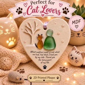 May include: A heart-shaped MDF plaque featuring a 2D printed design of a tree, a sea glass cat, and a sea glass person. The text reads: What matters most is not what we had, but that I had you by my side. Theink you for being part of my life.