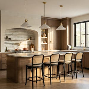 May include: A white ceramic mug with a black handle and the text "But First, Coffee" in a black, handwritten-style font. The mug is set against a blurred background.