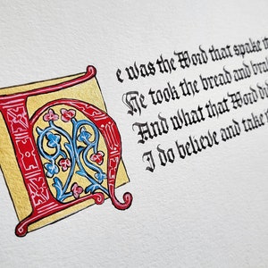 May include: A calligraphic illustration of a large red and gold letter "I" with blue and pink floral designs. The text "e was the Word that spake it; He took the bread and brake it; And what that Word did make it, I do believe and take it." is written in black ink.
