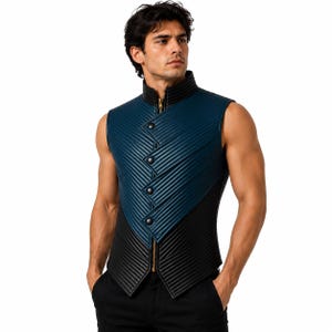 May include: A sleeveless vest featuring a high collar and a dual-tone design in dark blue and black. The garment is constructed with a ribbed texture, a vertical gold-toned zipper, and a diagonal front panel secured by four black circular buttons.