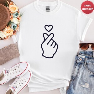 Korean heart hand gesture graphic tee with simple outline design, trendy and aesthetic casual clothing