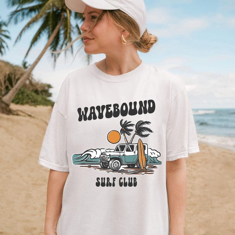 Ocean adventure graphic design with surfboard leaning on 4x4 vehicle by the beach with palm trees, sun and waves in retro surf art style.