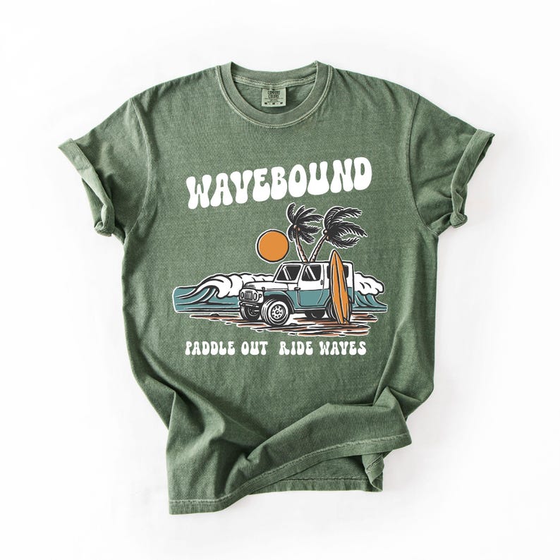 Surf lifestyle graphic tee artwork featuring classic 4x4 beach car, standing surfboard, tropical palms and rolling waves with Wavebound text.