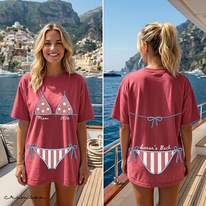 Destination wedding weekend tee with illustrated bikini artwork and editable names, dates, and locations.