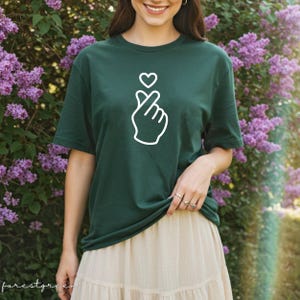 Simple Korean finger heart t-shirt with clean graphic, perfect for minimal fashion and everyday outfits