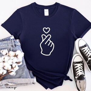 Trendy minimalist love shirt with finger heart icon, stylish and versatile unisex casual clothing option