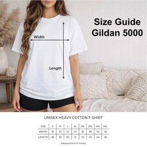 May include: A white unisex heavy cotton t-shirt with a size guide for Gildan 5000. The size chart shows measurements in inches for width and length, ranging from S to 5XL. The image also shows a person wearing the t-shirt.