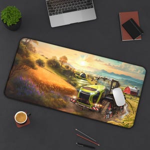May include: A rectangular mousepad featuring a vibrant farm scene with a green and black tractor. The artwork depicts a wheat field, a red barn, and a sunset. A white mouse sits on the pad, next to a laptop.
