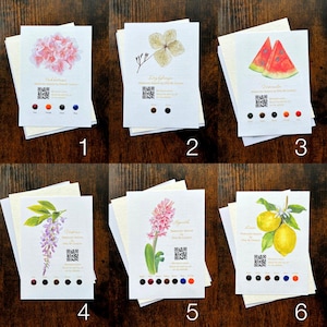 May include: Six watercolour art prints showcasing botanical illustrations of flowers and fruits. Each print includes a QR code and colour swatches. The prints are numbered 1 to 6.