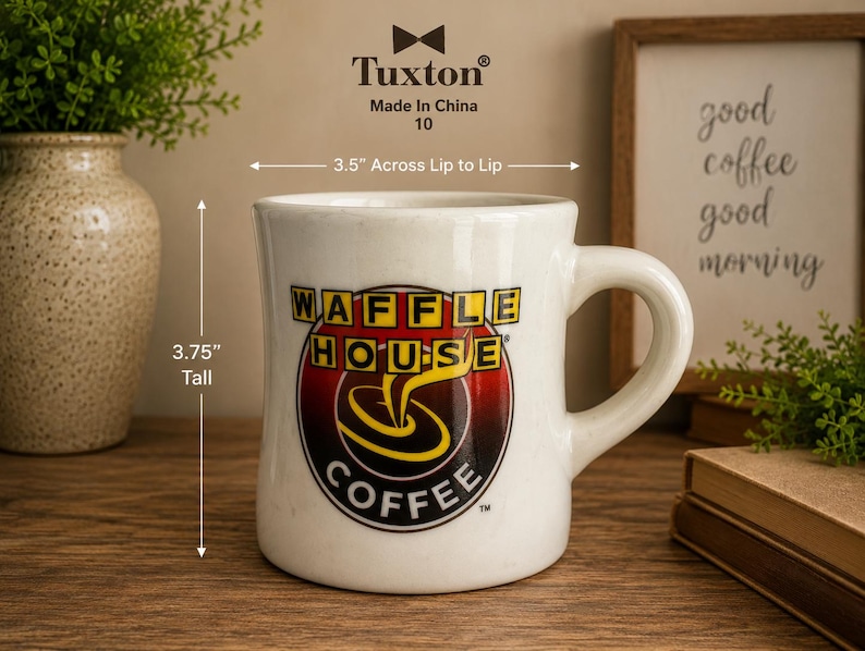 May include: A white ceramic Waffle House coffee mug. The mug is 3.75 inches tall and 3.5 inches across. The Waffle House logo is prominently displayed on the front, featuring a red, yellow, and black design.