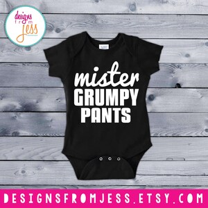 May include: Black baby onesie with white text that reads "mister grumpy pants".