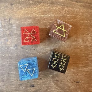 May include: A set of three ceramic mugs with a speckled, matte finish. The mugs are in shades of cream, light gray, and dark gray. Each mug has a simple, minimalist design, perfect for coffee or tea.