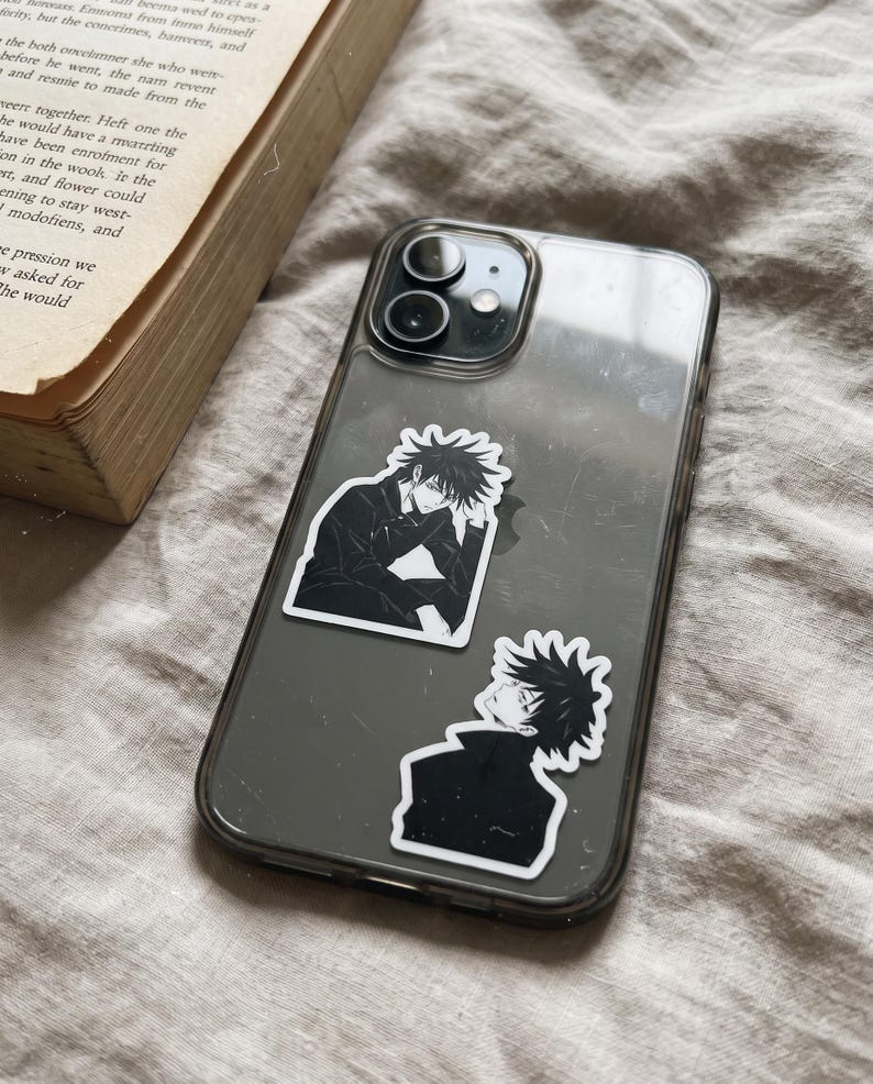 May include: A clear smartphone case featuring two black and white anime-style stickers of a character with spiky hair. The top sticker shows the character sitting with a hand on their chin, while the bottom sticker shows a profile view of the character.